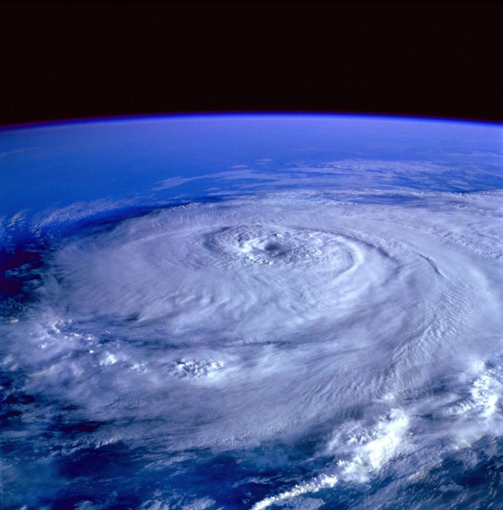 A breathtaking satellite image capturing a swirling hurricane over the Earth's ocean.